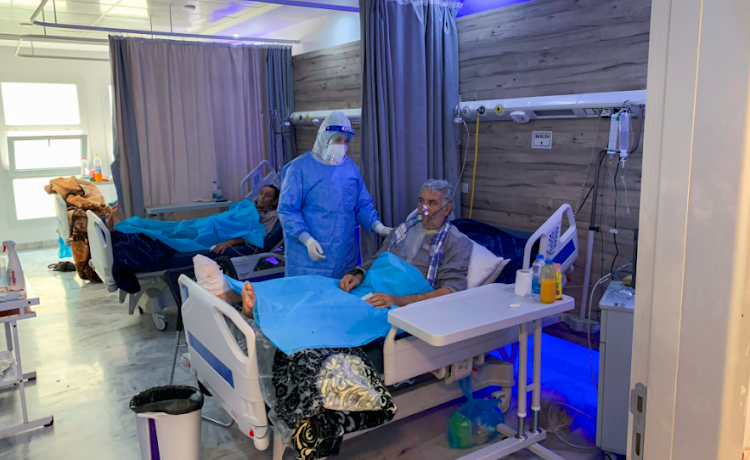 Aisha Milad Belhassna, a nurse wearing a protective suit, cares for patient infected with the coronavirus disease (COVID-19) at a quarantine centre, in Misrata, Libya on September 7, 2020. P