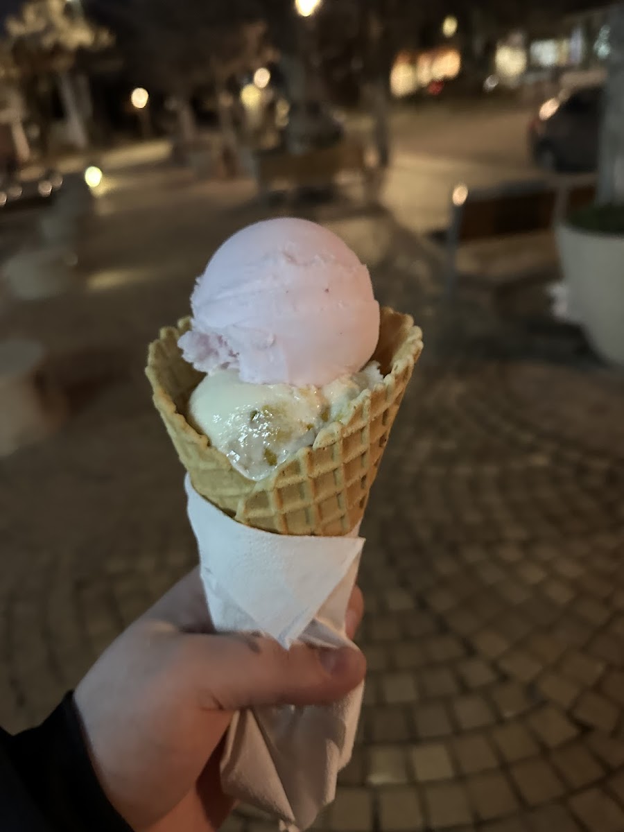 Rose petal lime sorbet and marscapone peach pistachio ice cream in a gluten free waffle cone