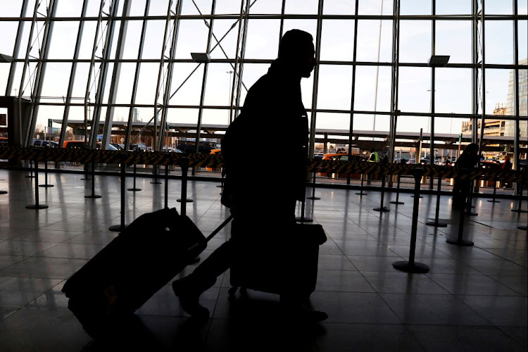 International travellers arrive at John F. Kennedy international airport in New York, US, on February 4 2017. The United States is screening visitors from Wuhan, China, at JFK and at airports in Los Angeles and San Francisco for people who may have symptoms of a new virus.