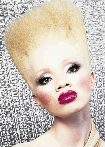 Thando Hopa is the face of designer Gert-Johan Coetzee's new collection at South African Fashion Week at the Crowne Plaza Hotel, Rosebank, Johannesburg, Friday night.