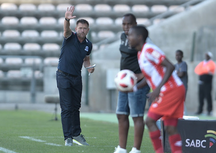 Maritzburg United coach Eric Tinkler dishes out instructions during a match.