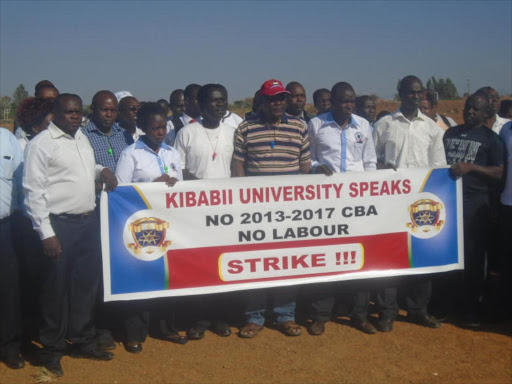 Lecturers of Kibabi university protest on Thursday at Tutti area along Kanduyi- Chwele road:PHOTOS BY BRINA OJAMAA.