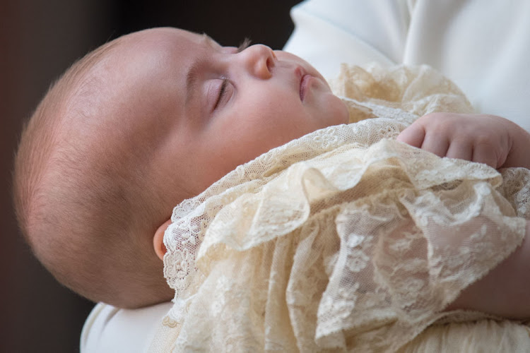 Prince Louis, son of Prince William and Kate Middleton, in a replica of the Honiton gown at his christening on July 9 2018 in London, England.