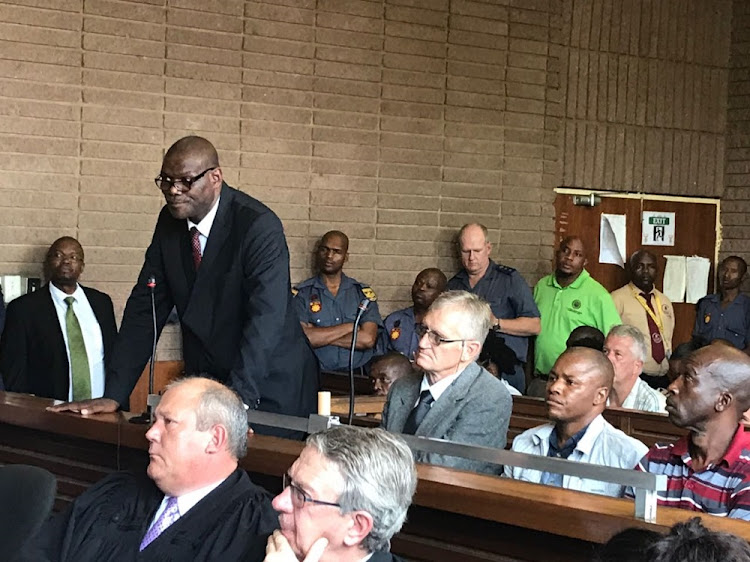 Former North West Deputy Police Commissioner William Mpembe alongside,Salmon Vermaak, Nkosana Mguye, Collin Mogale, Katlego Sekgweleya and Khazamola Makhubela appearing in the Rustenburg Magistrate's Court on charges of murder and defeating the ends of justice.