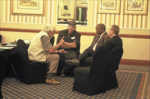 ATTENTIVE: Daryl Swanepoel, Gwede Matashe, Dr Piet Crouwkamp and Wynand Malan during a meeting yesterday with a group of 19 Afrikaner organisations under the theme 'Afrikaner Dialogue' which included professionals, academics, religious and business organisations. Photo: ELIZABETH SEJAKE