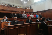 Nafiz Modack and co-accused in the dock at the high court in Cape Town. They face 124 charges, including being part of an alleged 'enterprise' run by Modack, unlawful interception of communications, murder, attempted murder, intimidation and kidnapping. File image.