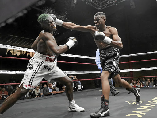 John Bopape, right, beat Wade Groth on Saturday In this file picture, Bopape knocked out Ricky Tshabalala in June.