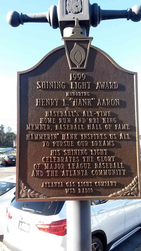 1999 SHINING LIGHT AWARD Honoring HENRY L. "HANK" AARON Baseball's all-time home run and RBI king Member, Baseball Hall of Fame Hammerin' Hank inspires us all to pursue our dreams His Shining...