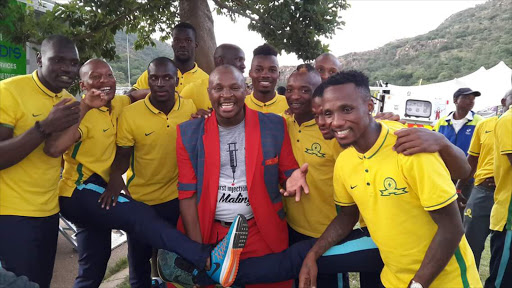 Singer Dr Malinga posing with Mamelodi Sundown' players on 5 January 2016.