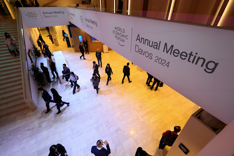 People walk inside the venue on the first day of the annual meeting in Davos, Switzerland, January 15 2024. Picture: DENIS BALIBOUSE/REUTERS