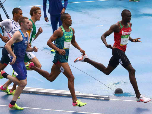 2016 Rio Olympics - Athletics - Preliminary - Men's 800m Round 1 - Olympic Stadium - Rio de Janeiro, Brazil - 12/08/2016. David Lekuta Rudisha (KEN) of Kenya reacts to Lutimar Paes (BRA) of Brazil REUTERS/David Gray