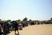 Pensioners queue at a South African Social Security Agency pay point in Mpumalanga