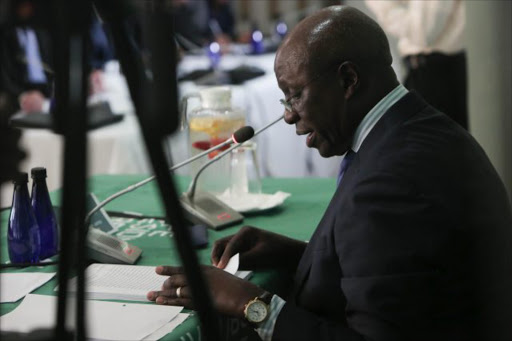 Former Deputy Chief Justice Dikgang Moseneke delivers the tabled compensation to families effected by the moving of mental health care users from Life Esidimeni to unequipped NGO’s that resulted in the deaths of 143 patients. Picture: Alaister Russell