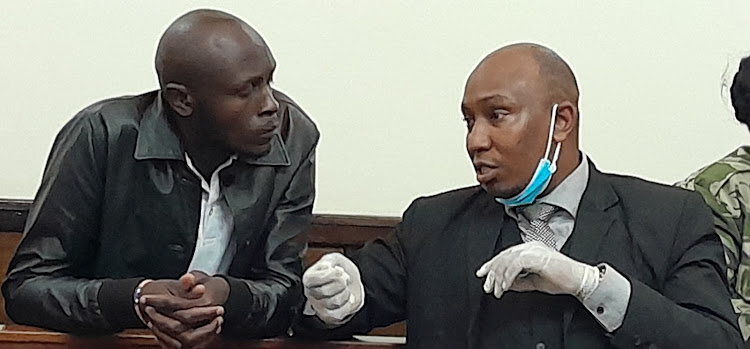 Suspect Jacktone Odhiambo (L) with his lawyer Mathai Maina at the High Court in Eldoret on May 7h 2024