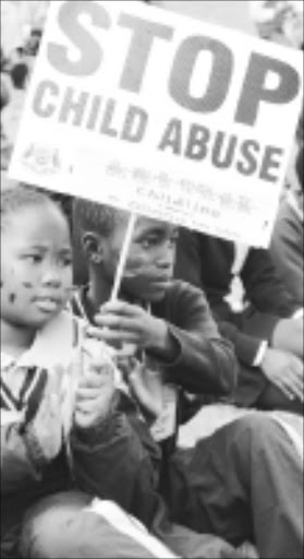 LOUD AND CLEAR: Kids protest against abuse. Pic. Elijar Mushiana. 10/08/2009. © Sowetan.