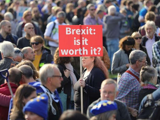 Demonstrators take part in the "People's Vote March for the Future" in central London on October 20, 2018. /COURTESY