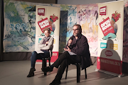 Festival organiser Frankie Murrey (left) and Mervyn Sloman, owner of the Book Lounge, in conversation at Open Book's July workshop week. 