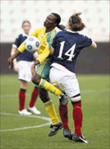 SAFE BOSOM: Banyana's Noko Matlou shields the ball from Rchel Corsie of Scotland. Circa 07/03/2009. © Unknown.