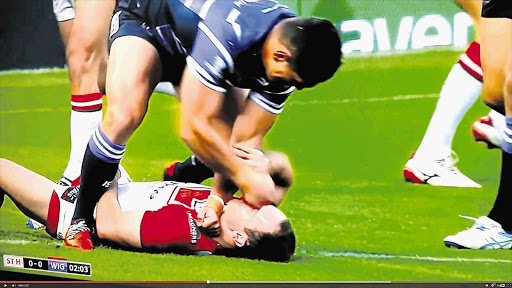 NOSE JOB: Wigan Warriors prop Ben Flower lays into prone St Helens back Lance Hohaia