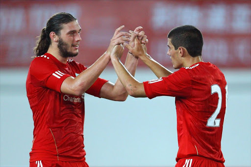 Andy Carroll (L) and Conor Coady (R) of Liverpool celebrates scoring a goal during the pre-season friendly match between Guangdong Sunray Cave and Liverpool at Guangdong Provincial People's Stadium on July 13, 2011 in Guangzhou, China