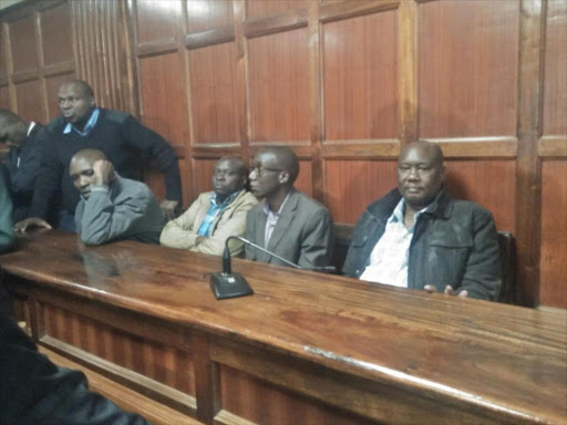 Governor Sospeter Ojaamong (right) at Milimani law courts. /CAROL MAINA