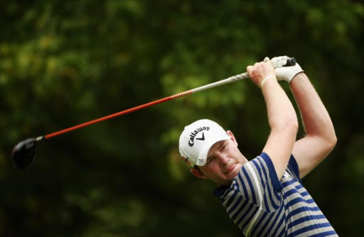 Branden Grace of South Africa tees off on the seventh hole during the second round of the Joburg Open at Royal Johannesburg and Kensington Golf Club on January 14, 2011 in Johannesburg
