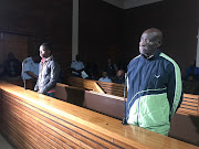 Fita Khupe, right, and Ernest Mabaso appear in the Lenasia Magistrate’s Court on seven counts of murder and theft after they allegedly killed members of the Khoza family in Vlakfontein last month.