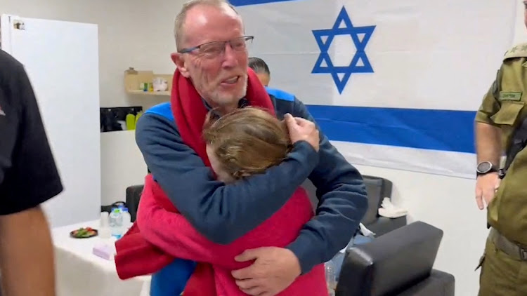 Irish-Israeli Emily Hand, who was abducted during the October 7 attack on Israel, meets her father Thomas Hand after being released as part of a hostages-prisoners swap deal between Hamas and Israelat an unknown location in Israel, in this screengrab from a handout video released November 26 2023. Picture: ISRAEL DEFENSE FORCES/HANDOUT via REUTERS