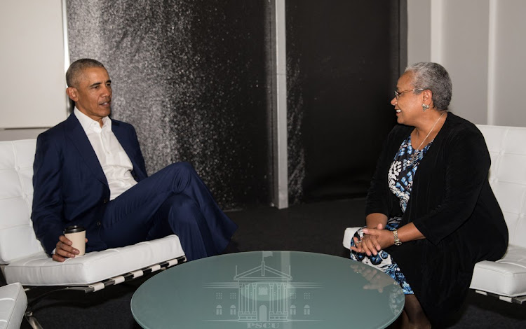 Former US President Barack Obama chats with First Lady Margaret Kenyatta on the sidelines of the 19th World Travel and Tourism Council (WTTC) Global Summit in Seville, Spain on April 3, 2019.