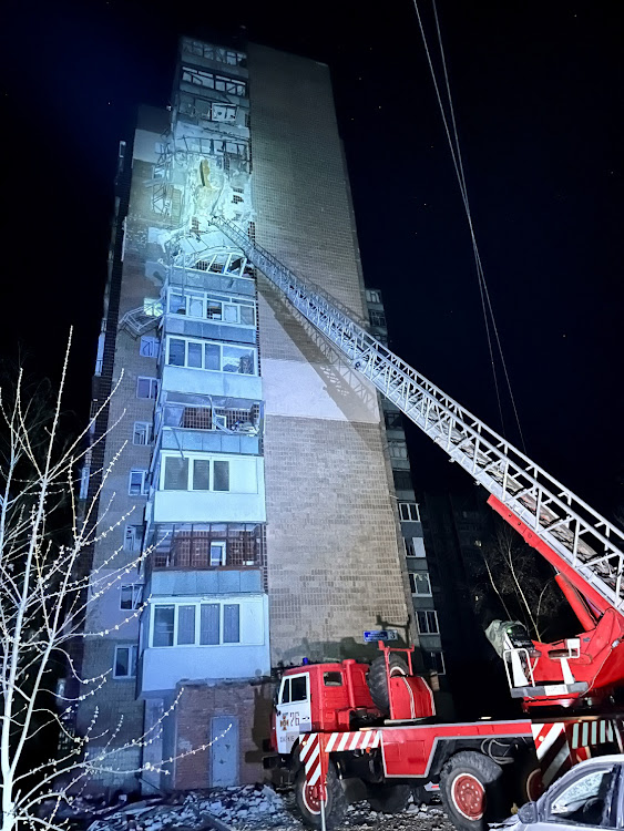 Rescuers work at the site of buildings damaged by a Russian drone strike, amid Russia's attack on Ukraine, in Kharkiv, Ukraine April 4, 2024. REUTERS