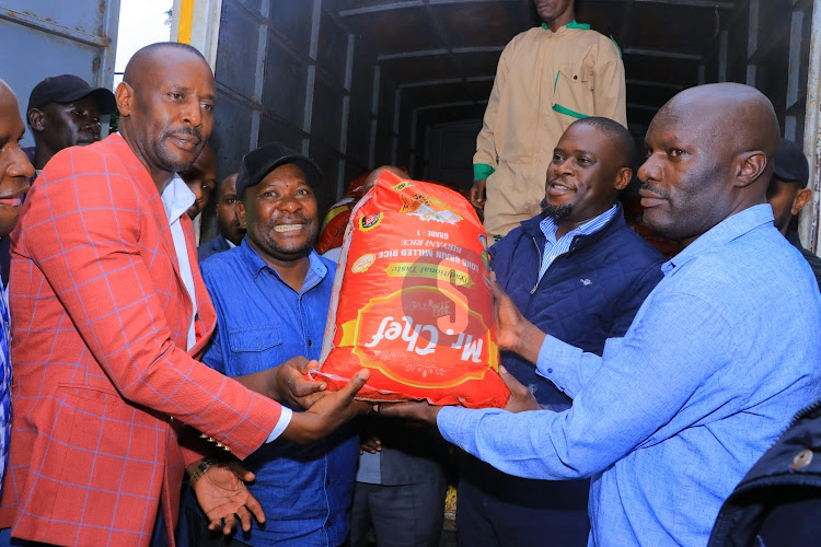 Nairobi Governor Johnson Sakaja distributes relief food to victims of floods in Kibera on April 29, 2024.