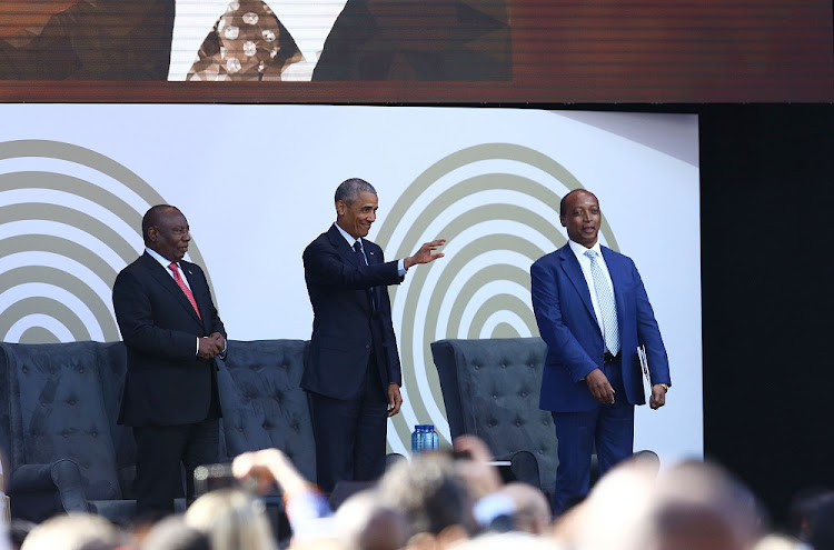 Former US President Barack Obama, centre, flanked by President Cyril Ramaphosa, left, and Patrice Motsepe greets those in attendance at the 16th Nelson Mandela Annual Lecture at Wanderers Stadium on July 17 2018. Picture: MASI LOSI