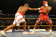 Flo Simba (White trunks) and Thabiso Mchunu (Red trunks) during the Cruiserweight bout between Thabiso Mchunu and Flo Simba at Emperors Palace on September 22, 2012 in Johannesburg, South Africa. Picture credits: Gallo Images