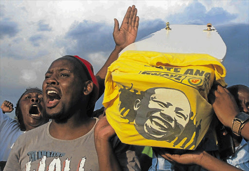 Jubilant rivals of suspended ANC Youth League president Julius Malema carry a coffin symbolising the end of his political career in Seshego Zone 1, Masakaneng, his home town in Limpopo.
