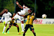 Wits' Thulani Hlatshwayo wins one of the many aerial battles that gave little room for  Bernard Parker and his Chiefs teammates in their Absa Premiership game   last night. Photo: Lefty Shivambu/Gallo Images