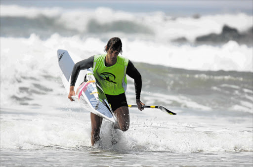 MAN OF THE MOMENT : 2017 Pete Marlin champ Matt Bouman comes tearing out of the surf in first place as he hits the shore at Yellow Sands on Saturday morning Picture: KERRYN FENN