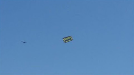Flying banner to advertise a strip club!!!