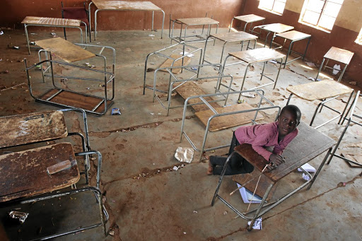 Matome Mokauke, 10, plays in a classroom at the dilapidated Ratjeke Primary School in Bolobedu, Limpopo. /ANTONIO MUCHAVE