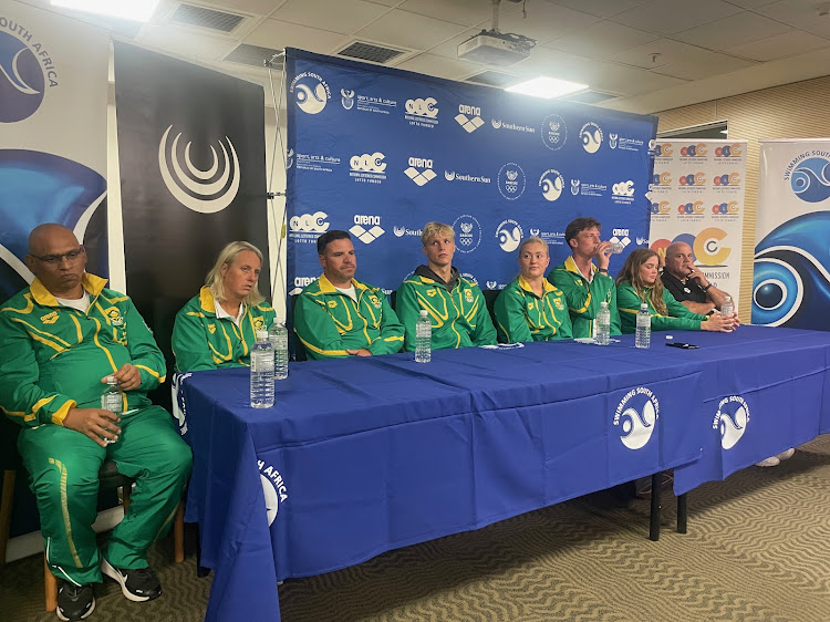Swimming South Africa president Alan Fritz, left, coaches Karin Hugo and Eugene da Ponte, swimmers Matthew Sates, Lara van Niekerk, Pieter Coetzé and Erin Gallagher and coach Rocco Meiring at a press conference on Monday.