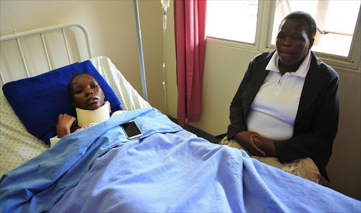 October 04 2016. Lucia Madolo, a pupil at Nkomazi High School , is recuperating at Tonga Hospital, Mpumalanga, after she survived a horrific car accident on the night of their matric dance. With her is her mother Nonhlanhla Nkosi. Photo: Veli Nhlapo © Soweta