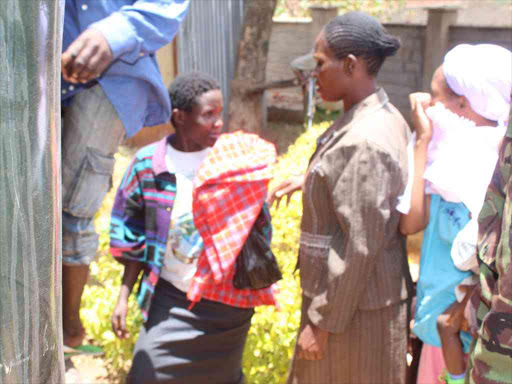 Purity Wanjiru (left), one of the three suspects of the murder of Thika businesswoman Joyce Wambui being led from Murang'a court, March 15, 2017. /ALICE WAITHERA