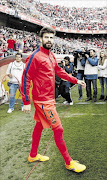 WEAK LINK?:  An error from Barcelona's  Gerard Pique led to Sevilla's equaliser in a La Liga match against Barca on Saturday that ended 2-2
      PHOTO: Marcelo del Pozo/REUTERS