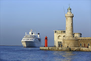 A cruise ship approaches Marseille harbour; cruising can be a relatively affordable option for visiting Europe