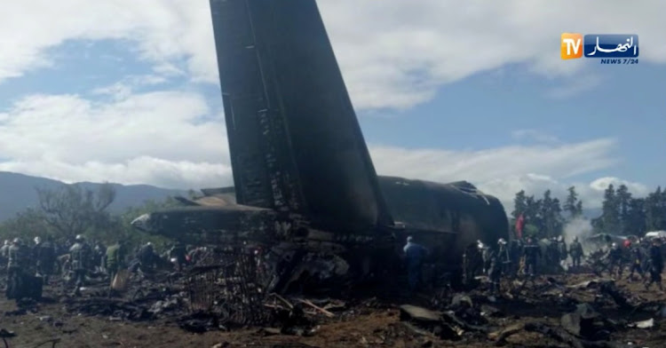 An Algerian military plane is seen after crashing near an airport in Algeria on April 11 2018 in this still image taken from a video.