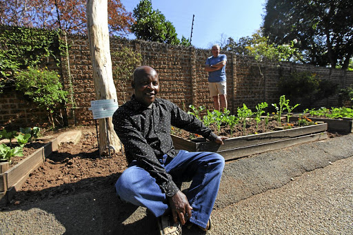 Isaac Morwasehla and David O'Sullivan in Craighall, Johannesburg, where they have turned their pavement into a community vegetable patch.