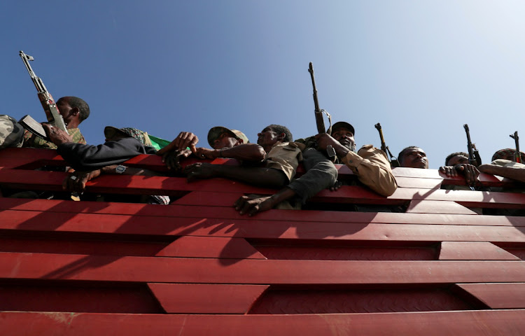 Militia members ride on a truck to go fight the Tigray People's Liberation Front in Sanja, Amhara region, near a border with Tigray, Ethiopia. File Picture: REUTERS/TIKSA NEGERI