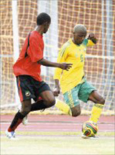 NO WAY OUT: Bafana Bafana's Sibusiso Zuma gets the attention of a Black Mambas' defender in Durban yesterday. Pic. Anesh Dehiky. 13/01/2008. © Backpapix