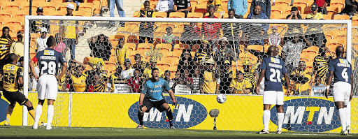 THE WAY TO DO IT: Benard Parker of Kaizer Chiefs equalises from the penalty spot during the Top8 encounter against Wits at Soccer City. Chiefs went on to win 2-1 Picture: SYDNEY SESHIBEDI