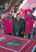 EFF general secretary Godrich Gardee, left, commander-in-chief Julius Malema and deputy president Floyd Shivambu toasting the party's second anniversary in Rustenburg yesterday.