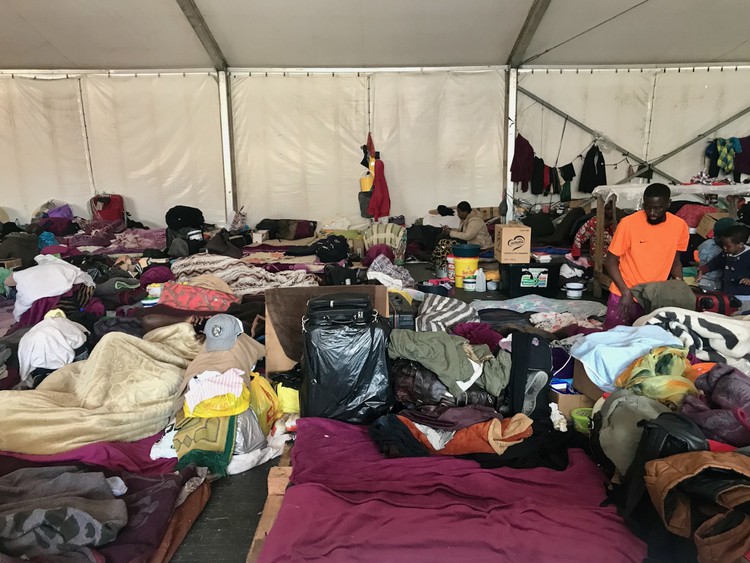 The refugee camp in Bellville. Males older than 18 sleep in their own marquee. They may visit the female marquee after 9am.